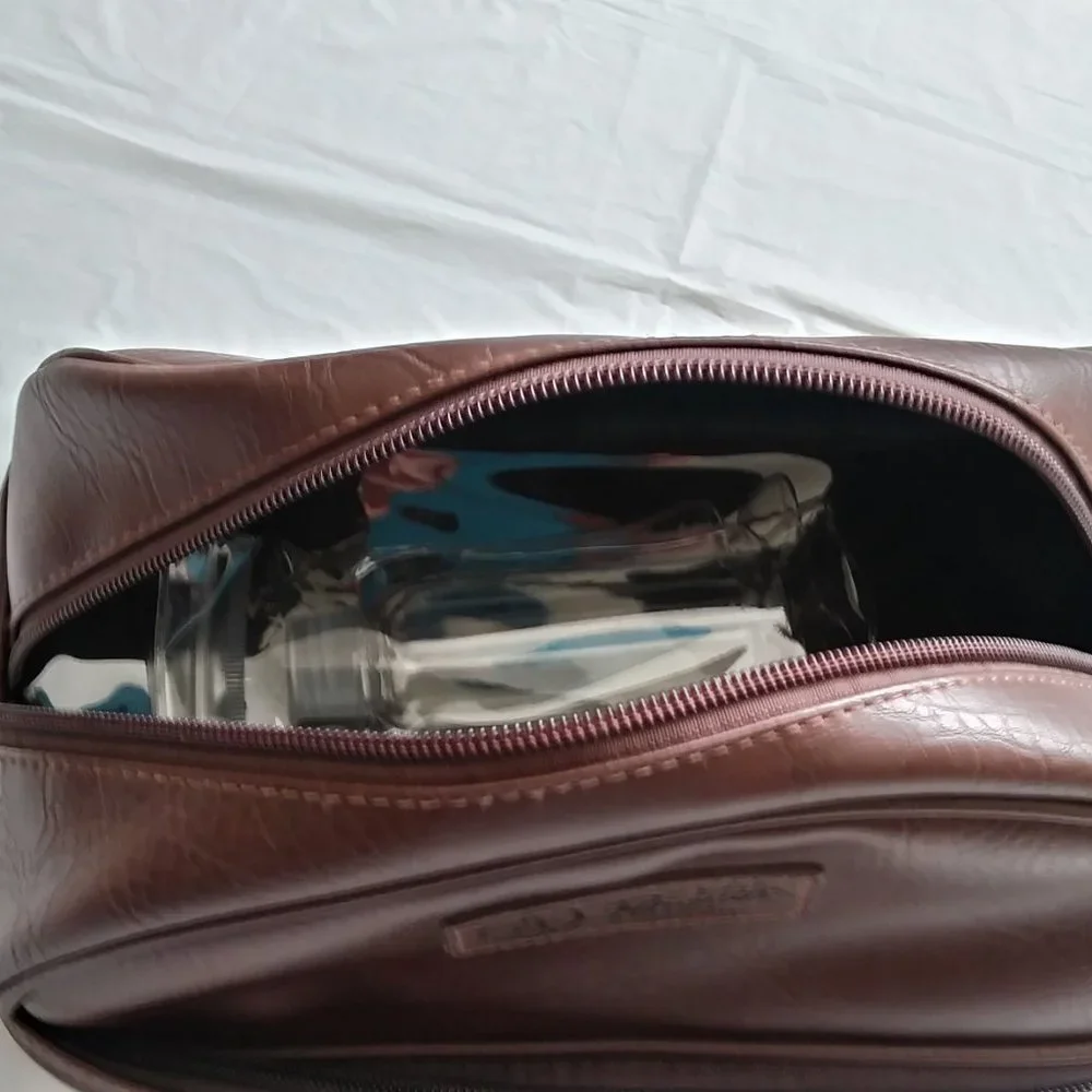 ORIGINAL PENGUIN. brown men's travel bag.